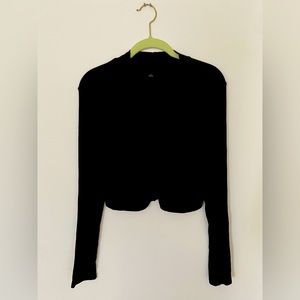 Black crop top with ruching down front.  Neck band, long sleeves